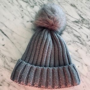 Gray hat with pompom and fuzzy lining